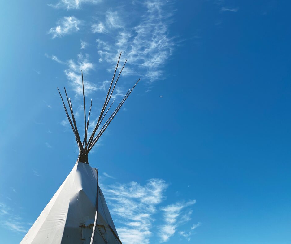 Illustration of an Indigenous tipi in a natural setting.